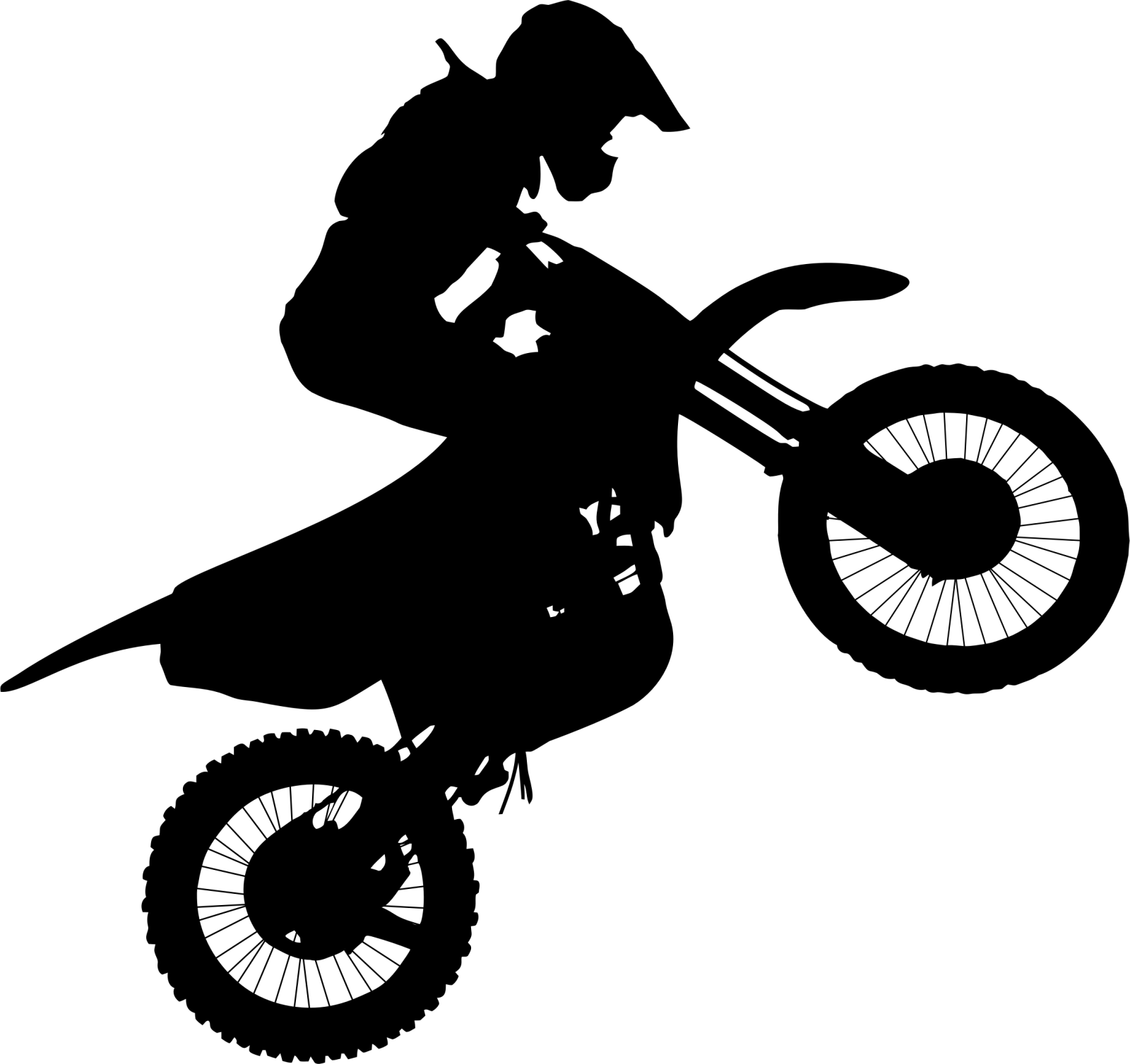 a silhouette of a person riding a dirt bike