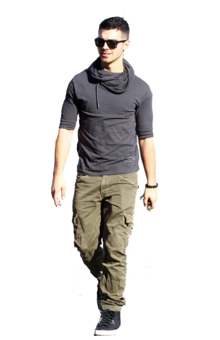 a man wearing a black hoodie and green cargo pants
