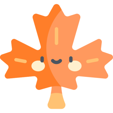 an orange maple leaf with black eyes
