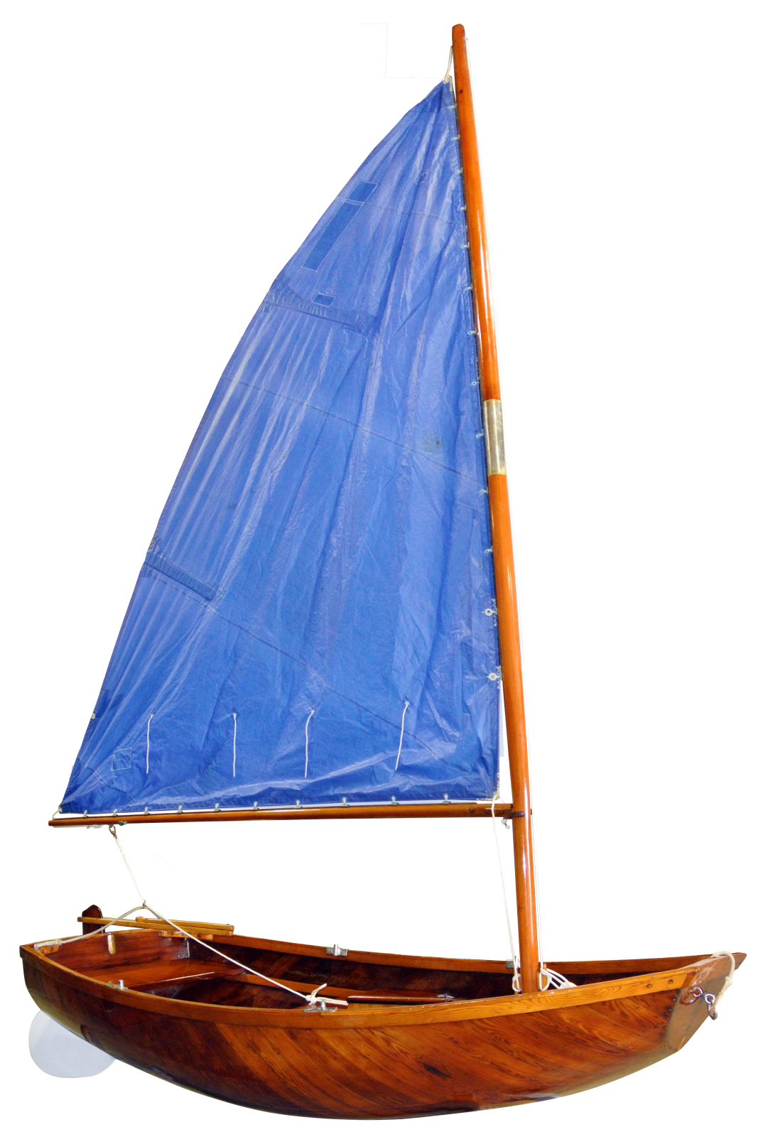 a wooden sailer with blue sails on a white background