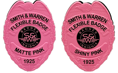 a pair of pink police badges