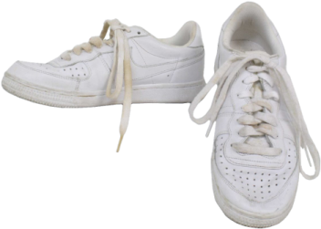 a pair of white sneakers on a white background
