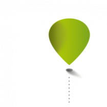 a green balloon flying through the air
