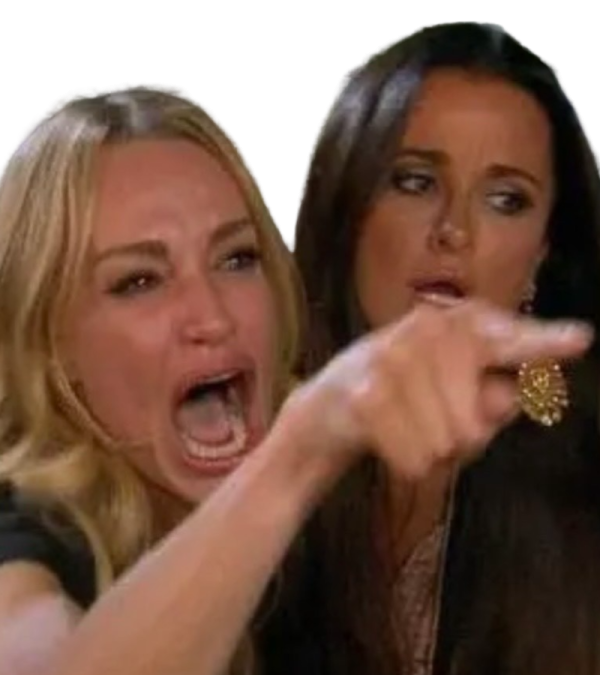 two women are pointing their fingers at the camera