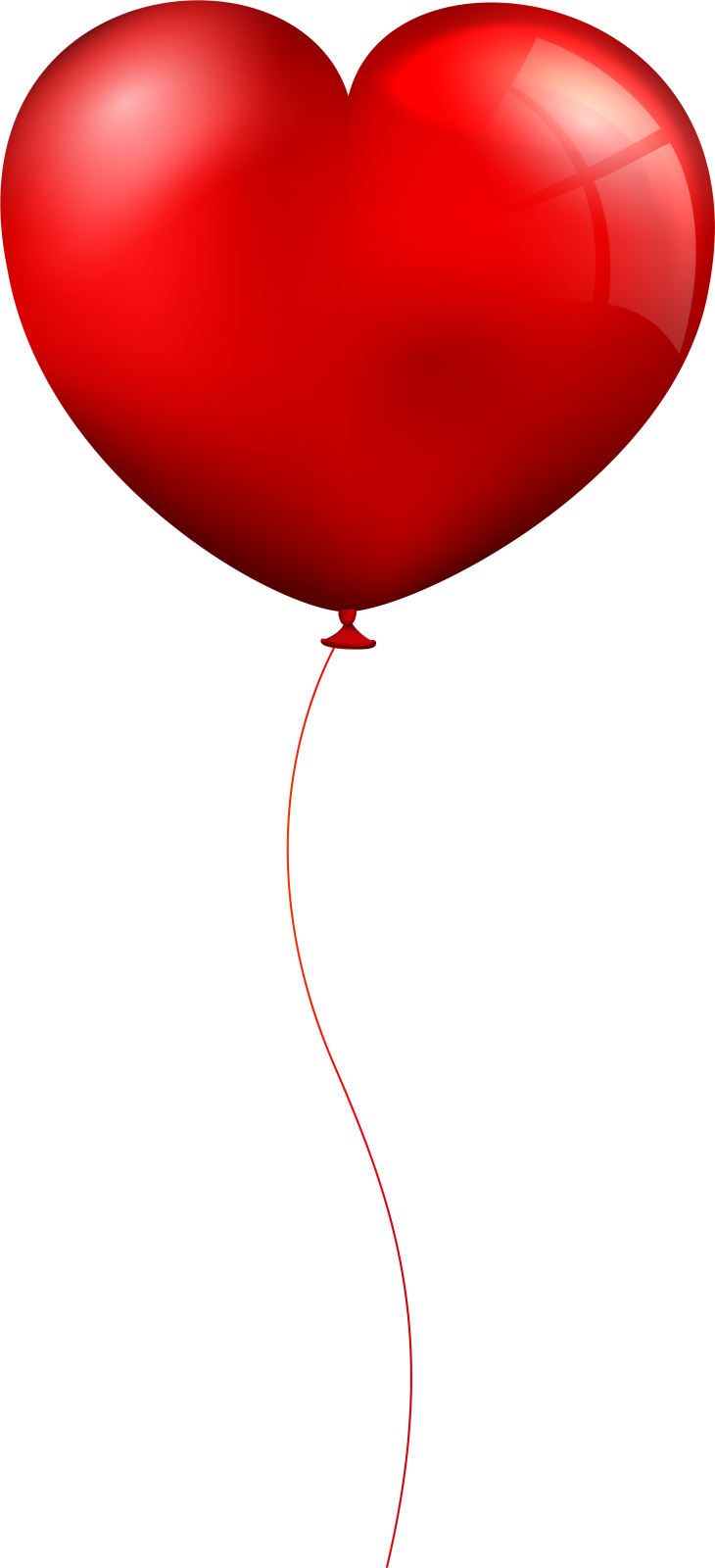 a red heart shaped balloon flying in the air