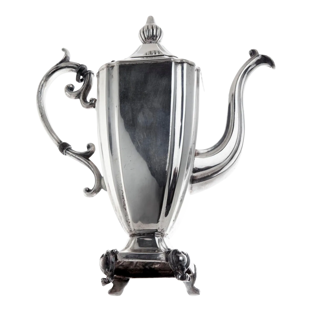 an antique silver plated teapot on stand