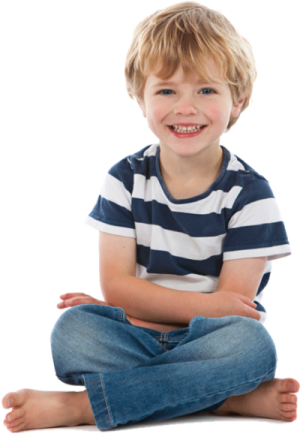 a little boy sitting on the floor with his legs crossed