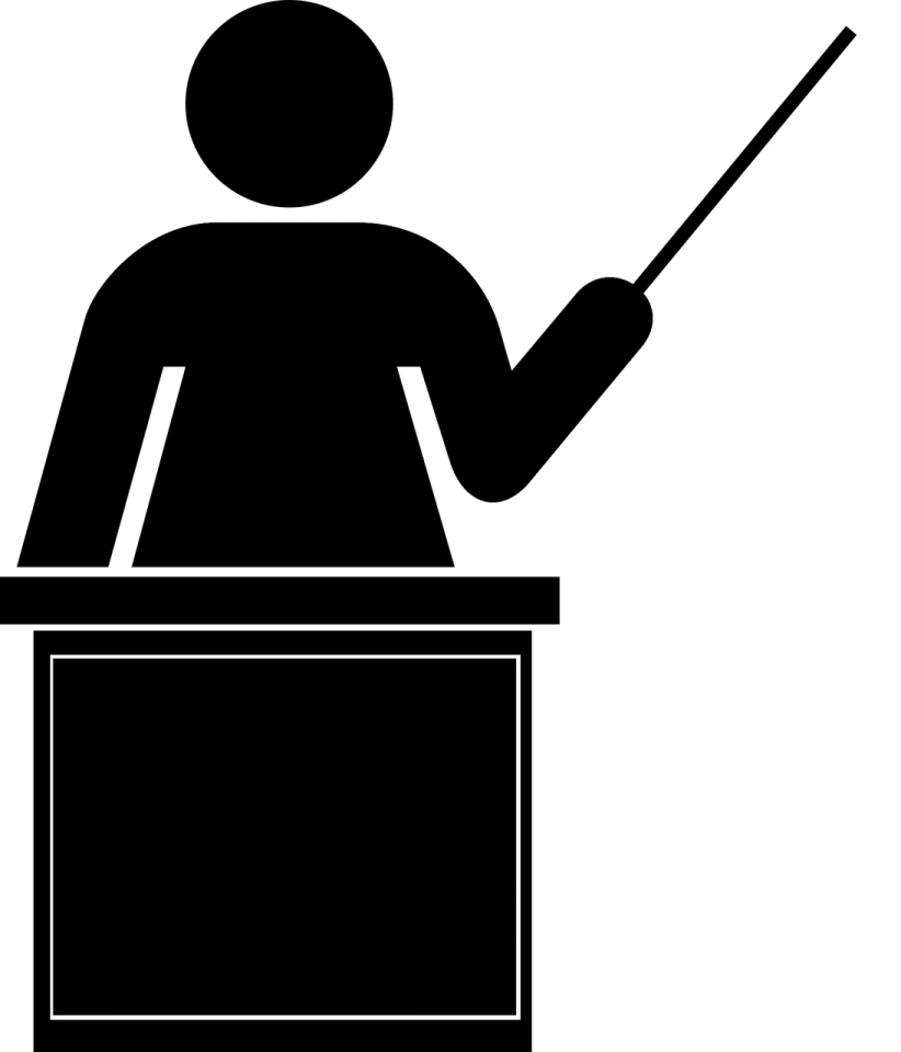a black and white silhouette of a person at a podium