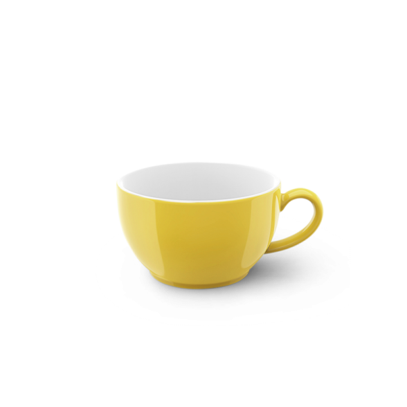 a yellow cup on a white background
