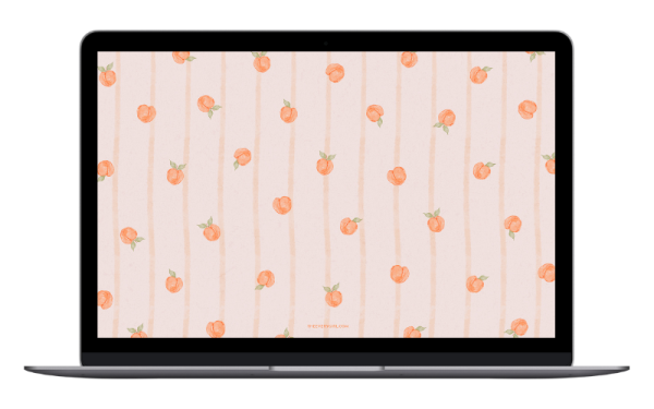 a laptop with a peach pattern on the screen