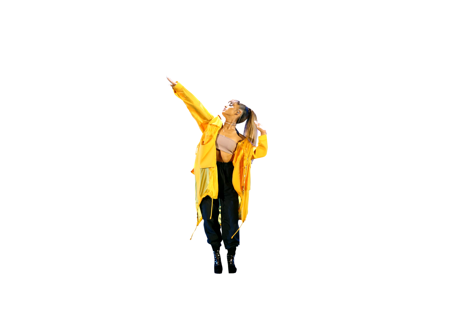 a woman in a yellow raincoat and black pants