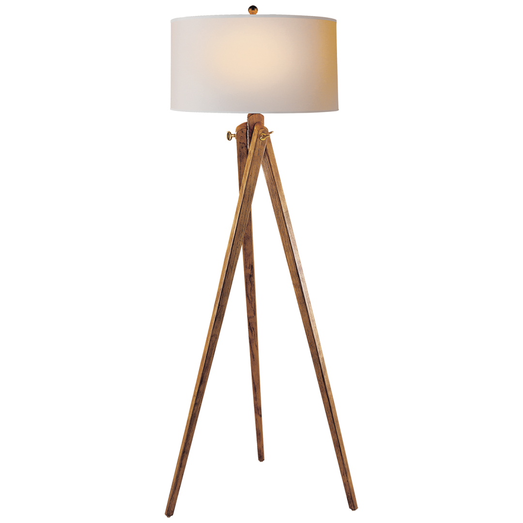 a wooden floor lamp with a white shade