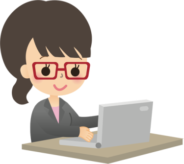 a woman in glasses working on her laptop