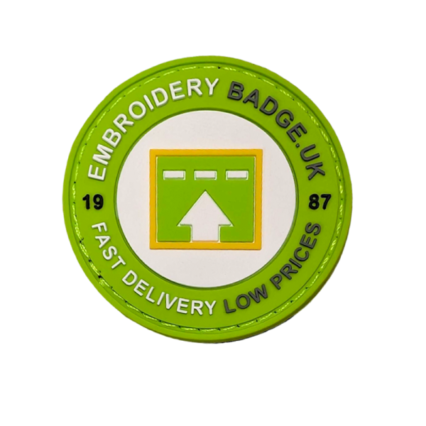 a green and white badge with an arrow in the center