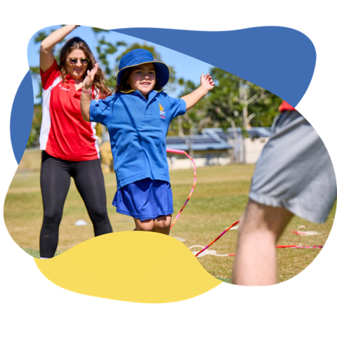 a boy and girl playing with a kite