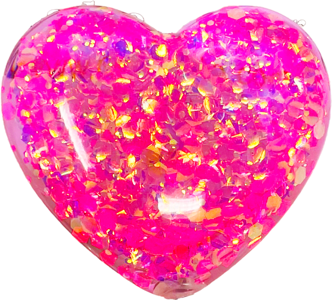 a pink heart shaped balloon filled with glitter