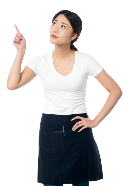 a woman in an apron pointing at something