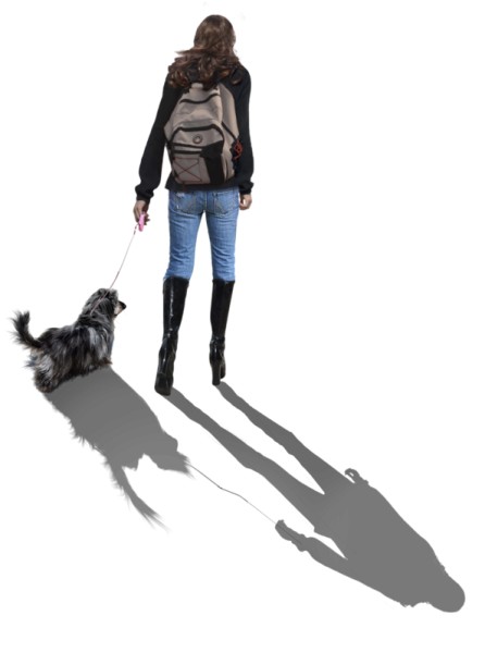 a woman walking her dog on a leash