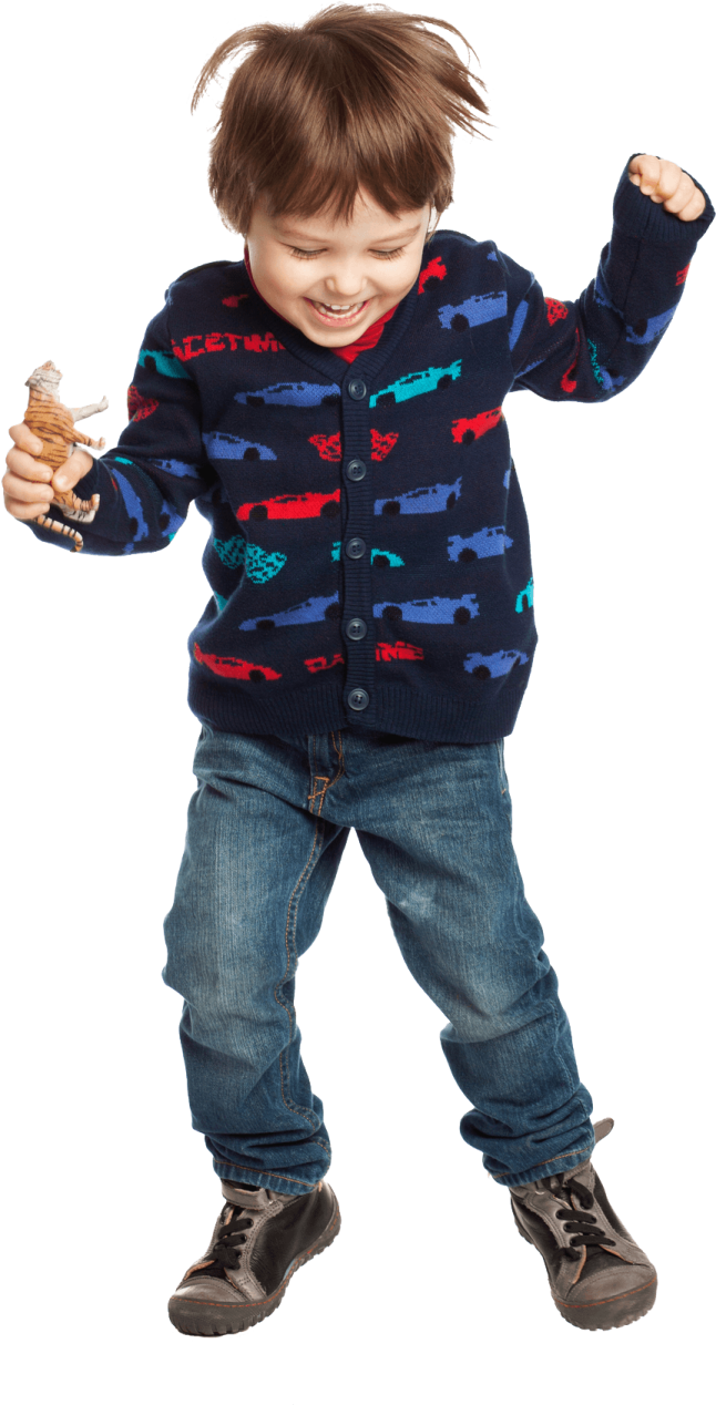 a young boy in a blue sweater and jeans
