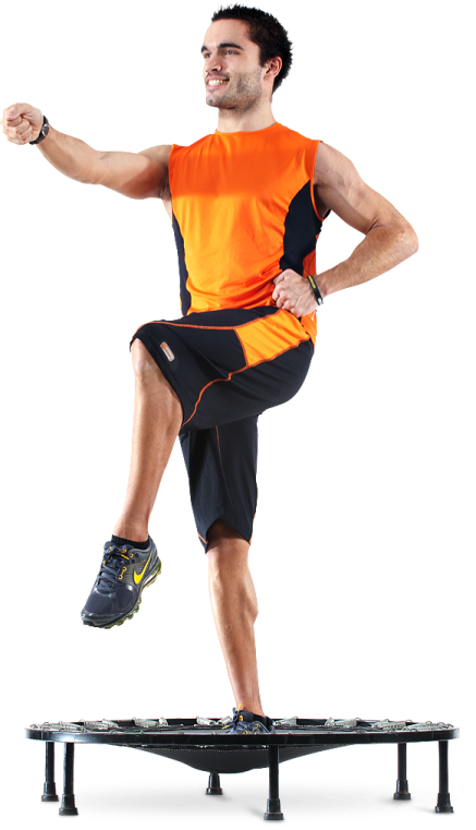 a man in an orange shirt is jumping on a skateboard