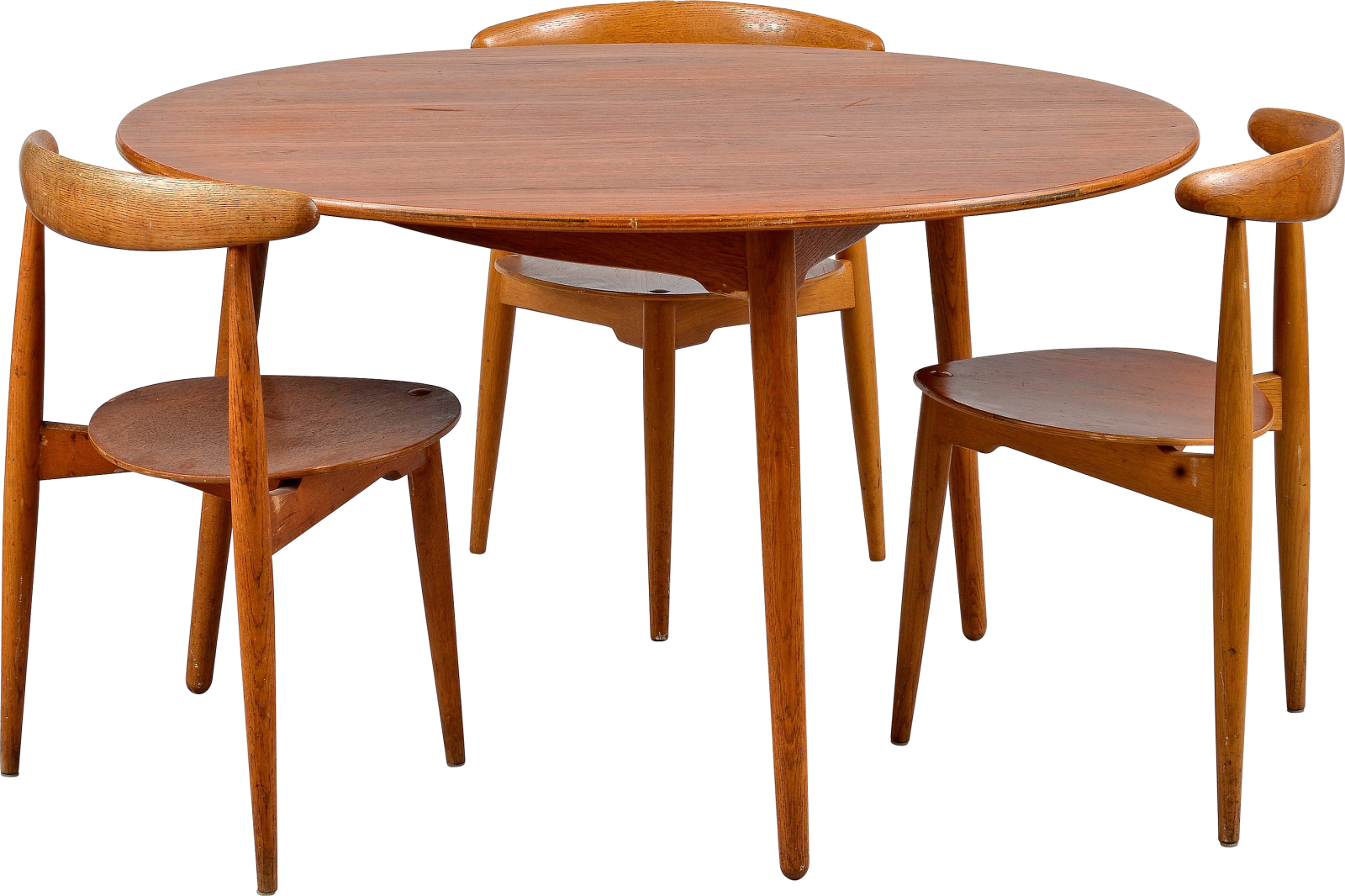 a round wooden table with four chairs