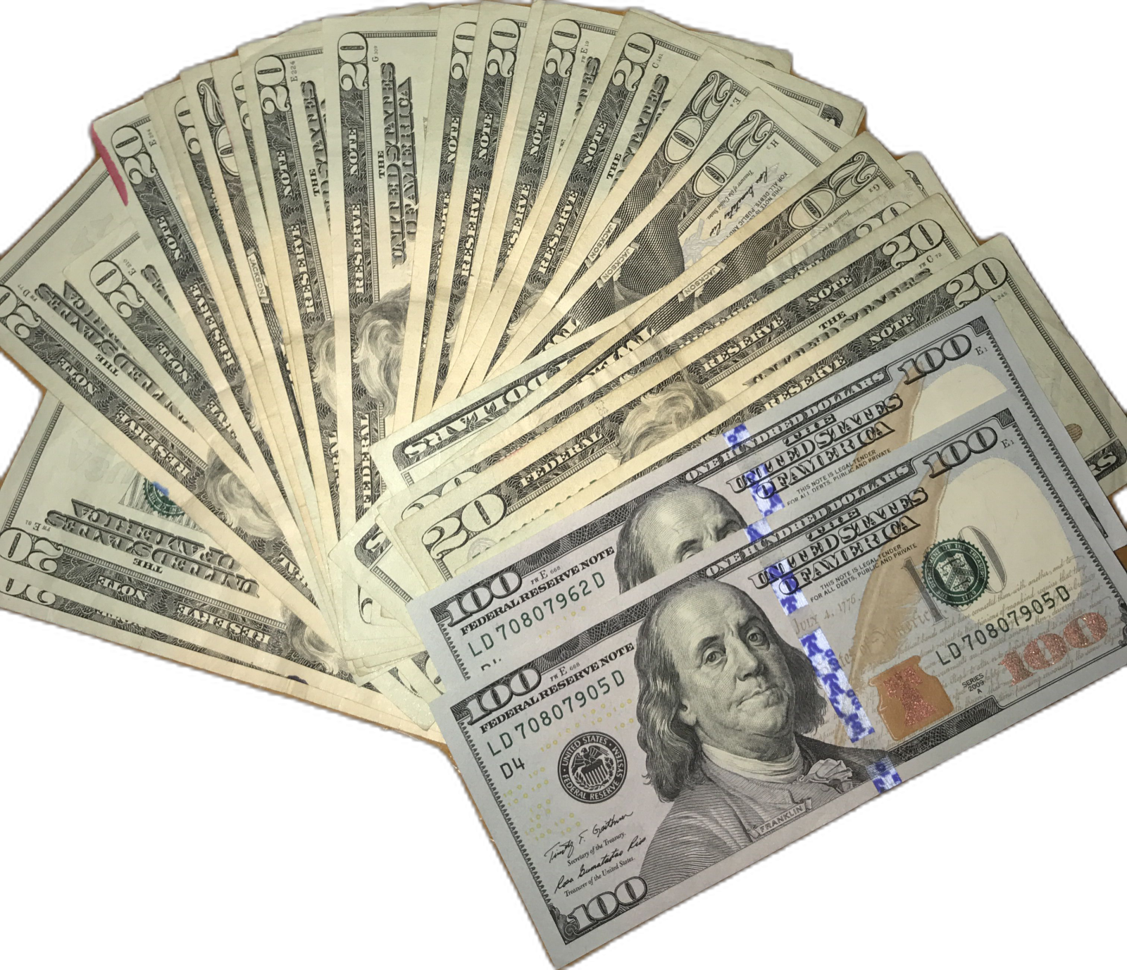 a pile of hundred dollar bills