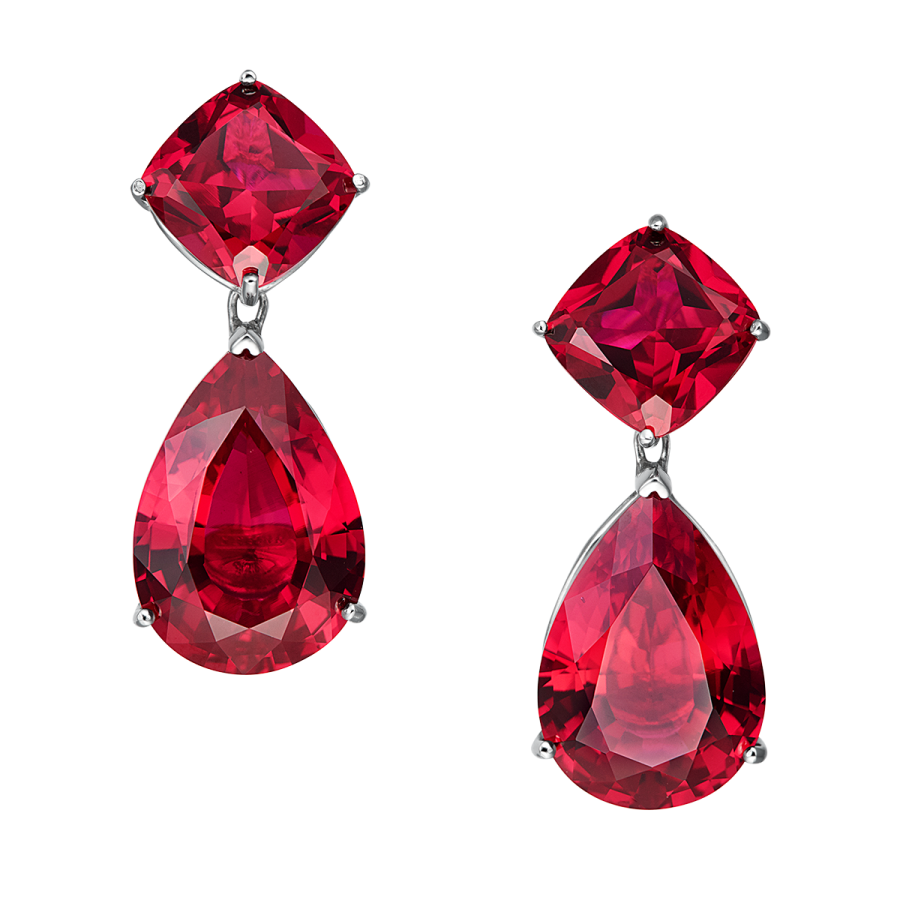 a pair of earrings with red crystals