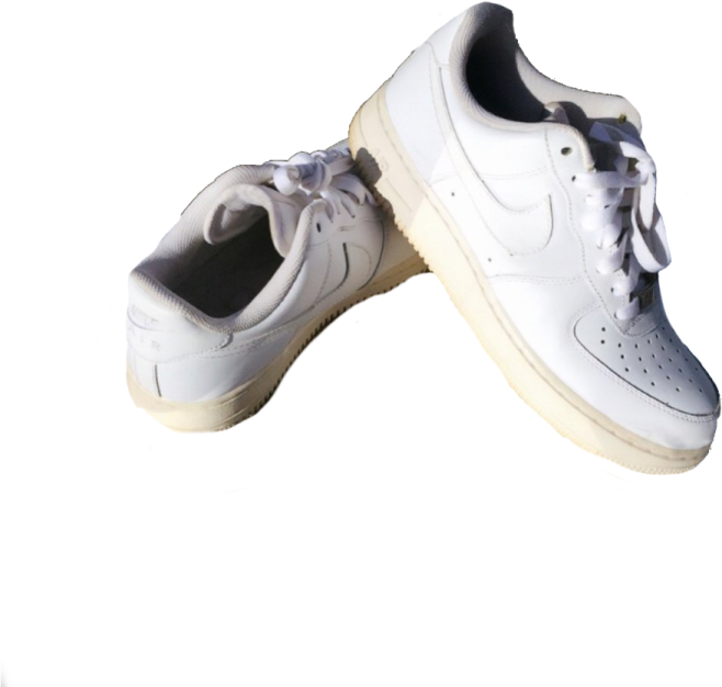 a pair of white sneakers on a white background