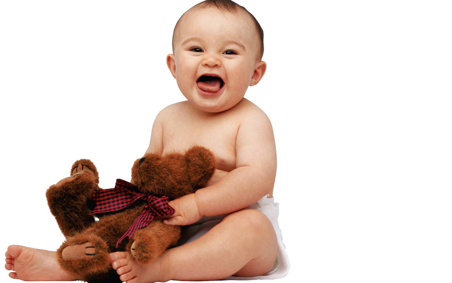 a baby sitting on the floor with a teddy bear