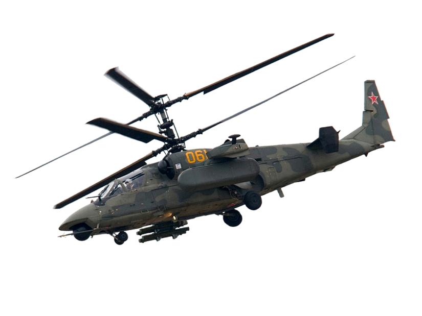 a military helicopter flying through the air