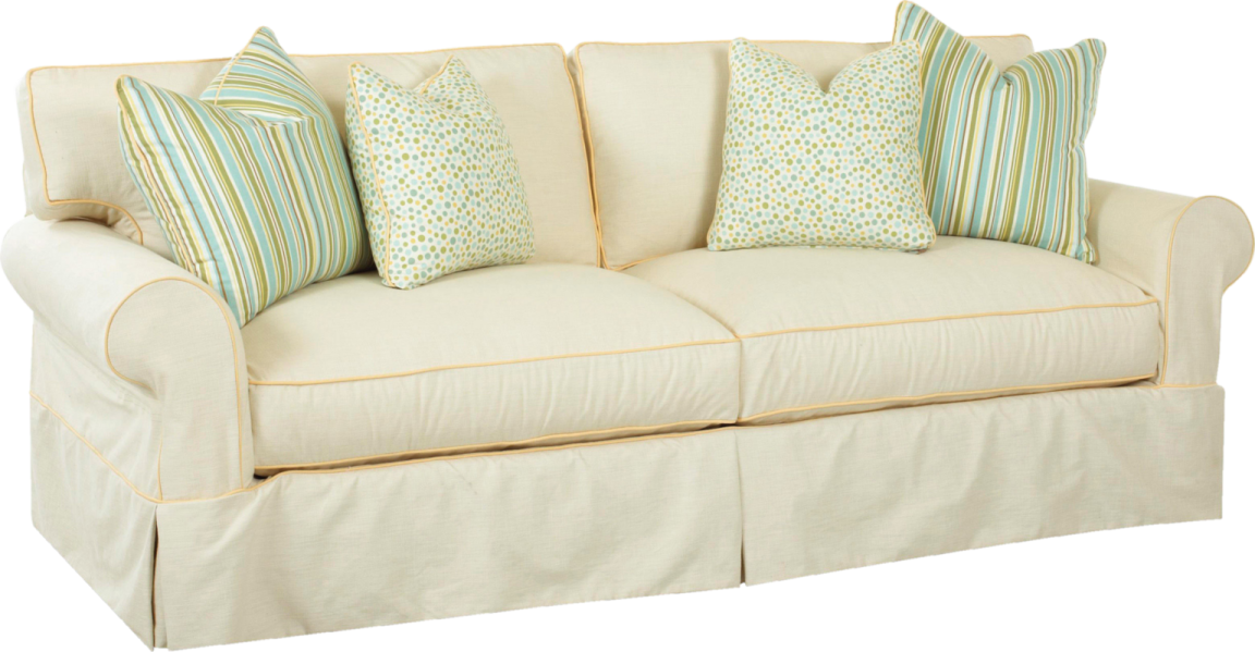 a white couch with blue and green pillows