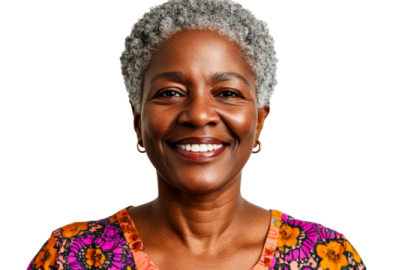 an older woman with grey hair smiling at the camera