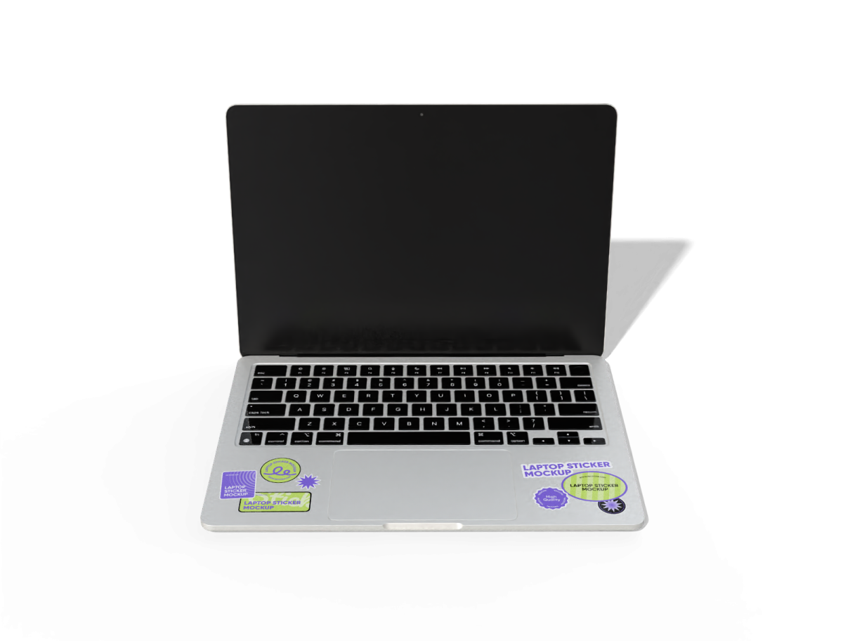 an open laptop computer on a white surface