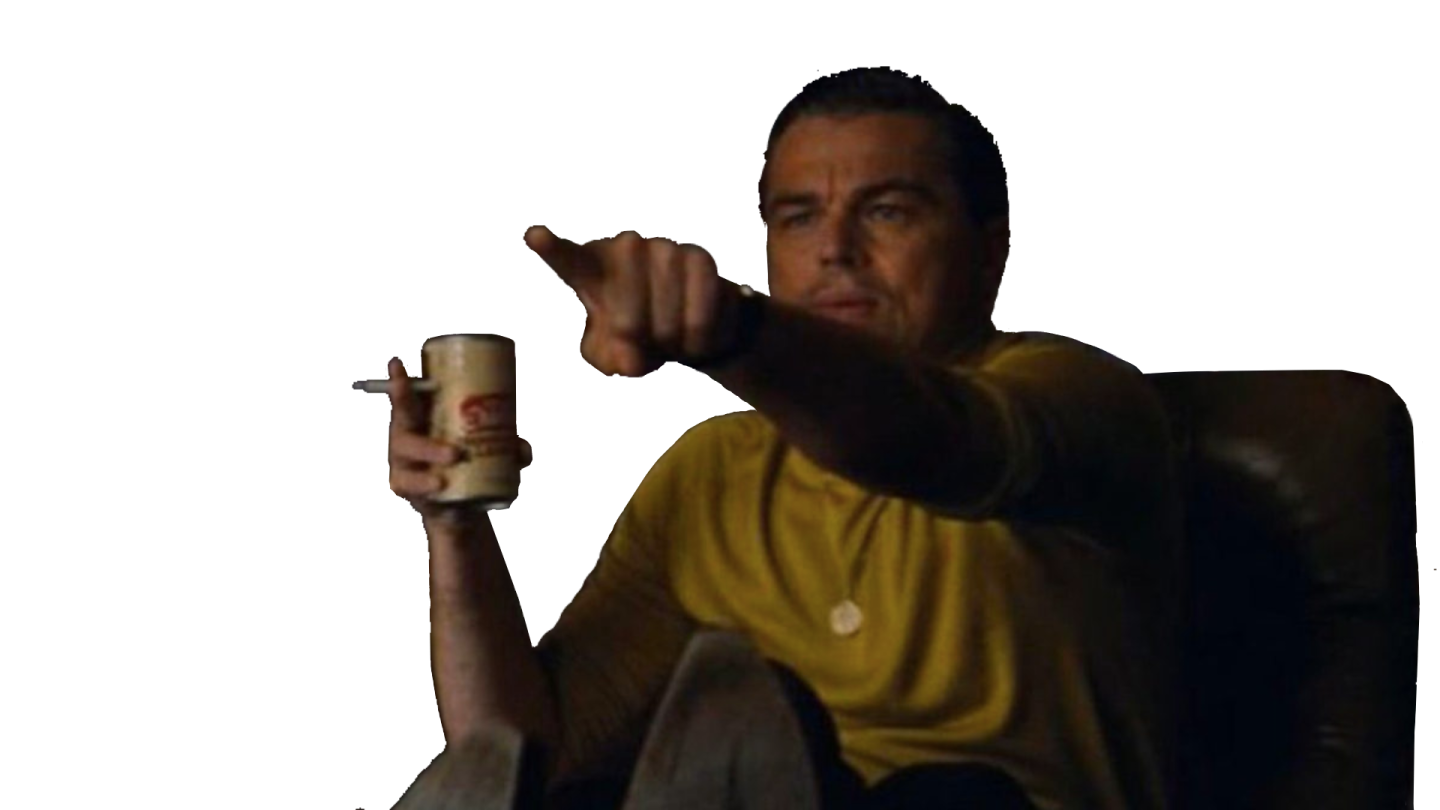 a man sitting in a chair holding a cup