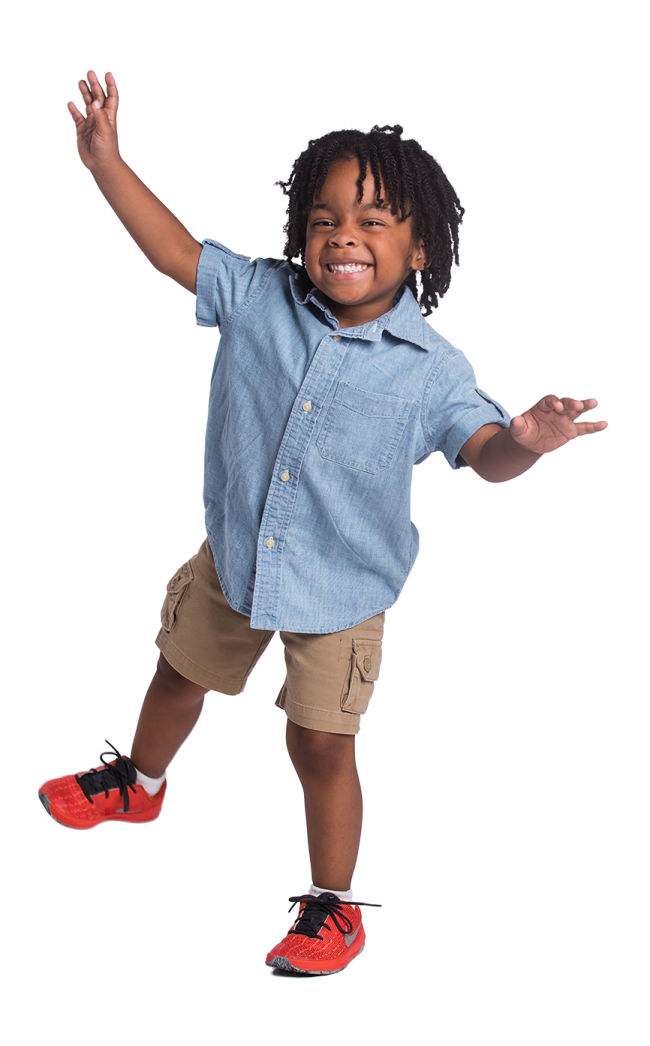 a little boy is jumping in the air