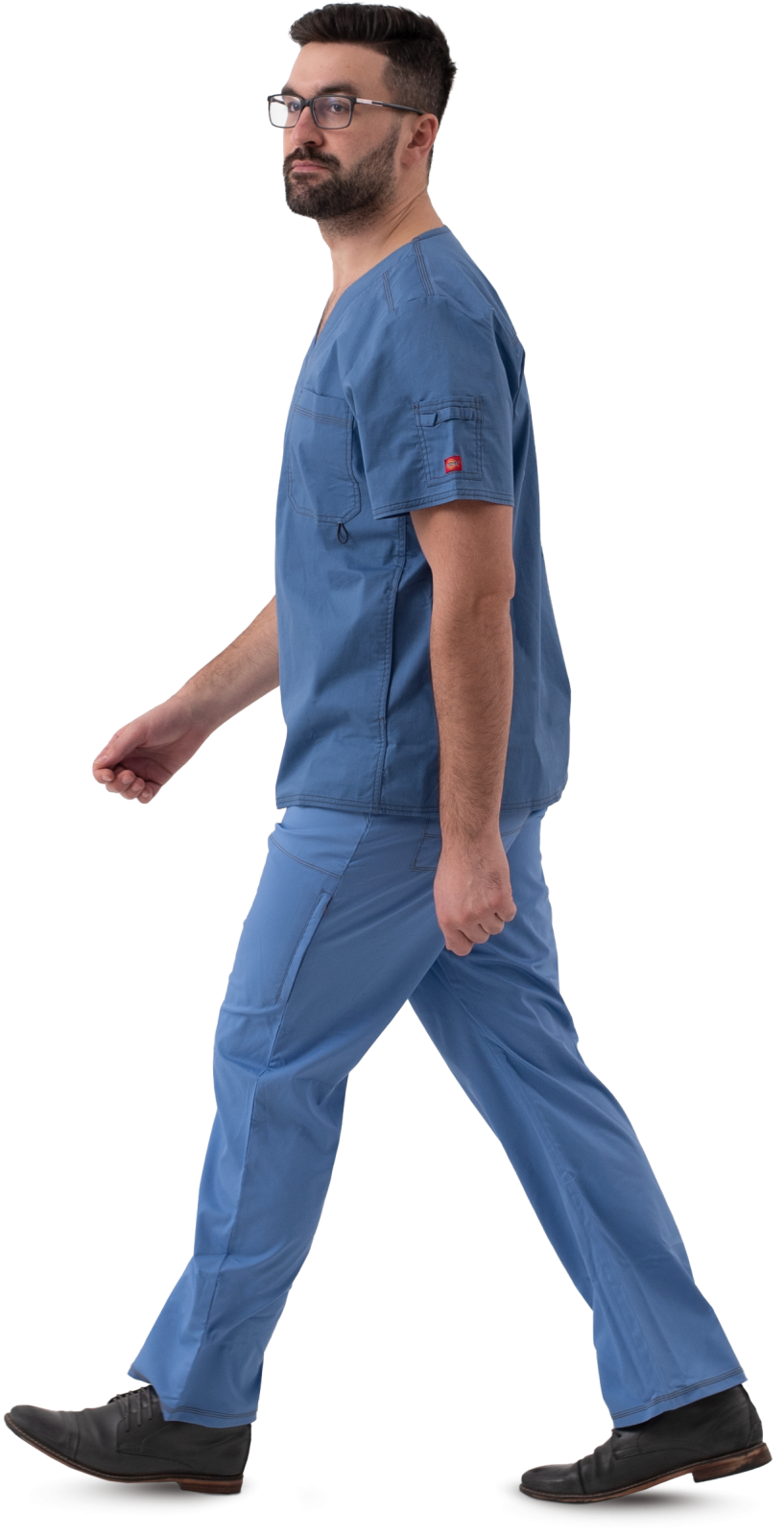 a man in scrubs walking on a white background