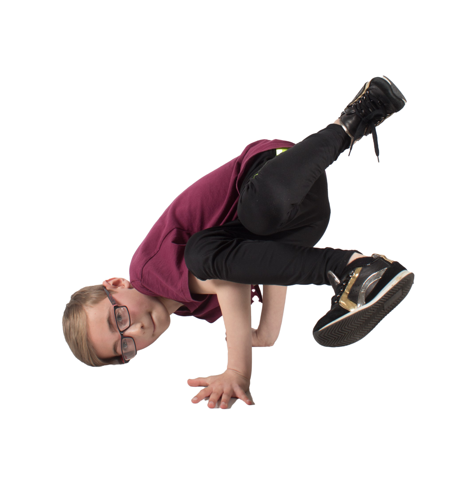 a young boy doing a trick on a skateboard