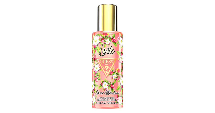 a bottle of perfume with pink flowers on it