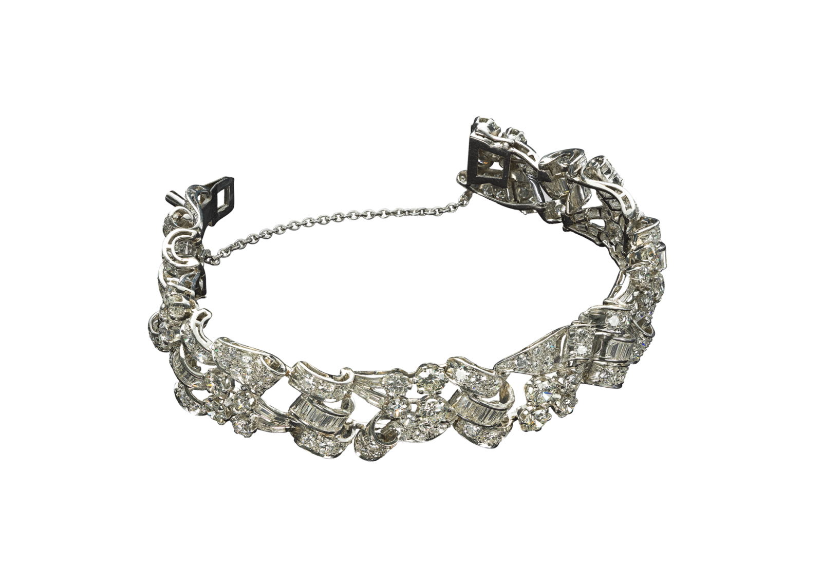 a silver bracelet with flowers and leaves