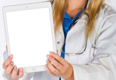a woman in a white lab coat holding a tablet