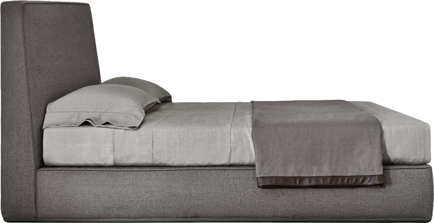 a gray bed with pillows on top of it