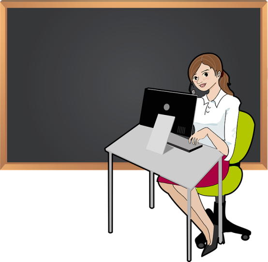 a woman sitting in front of a blackboard