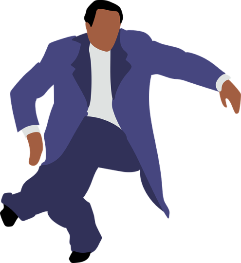 a man in a blue suit is dancing