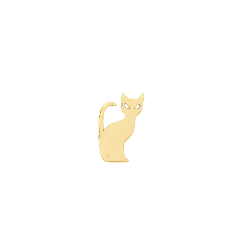 a gold cat charm on a white background