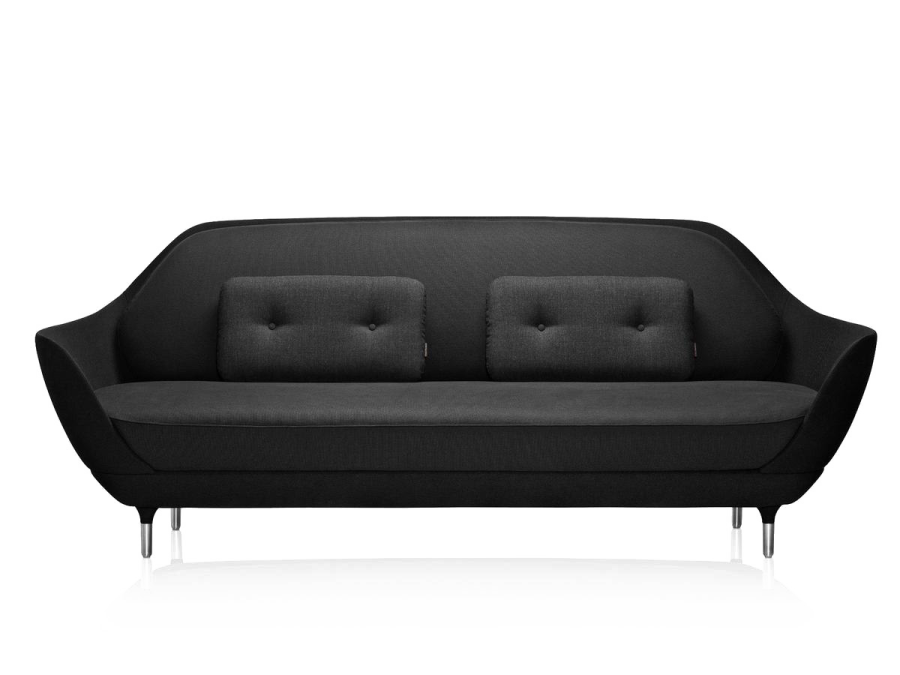 a black sofa with two pillows on it