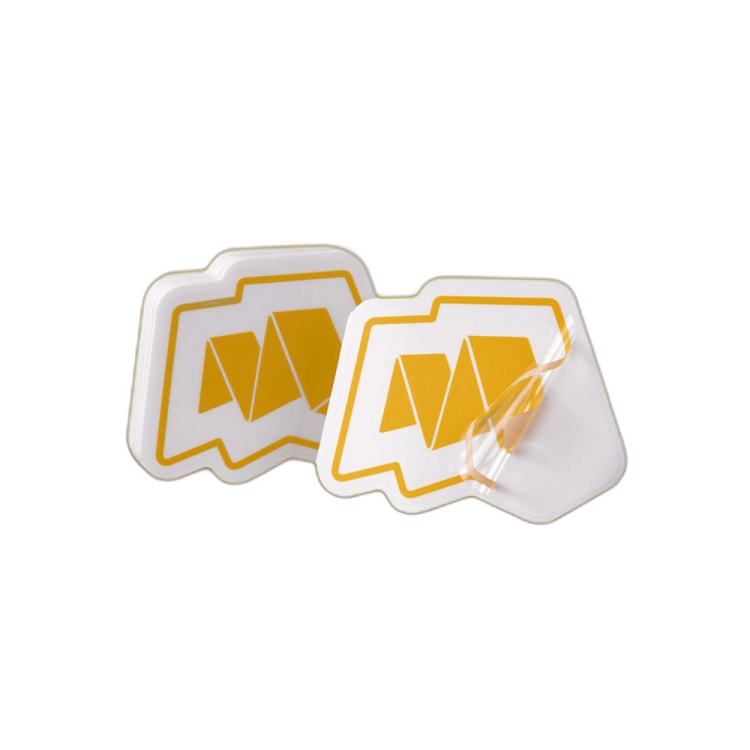 a pair of yellow and white stickers on a white background