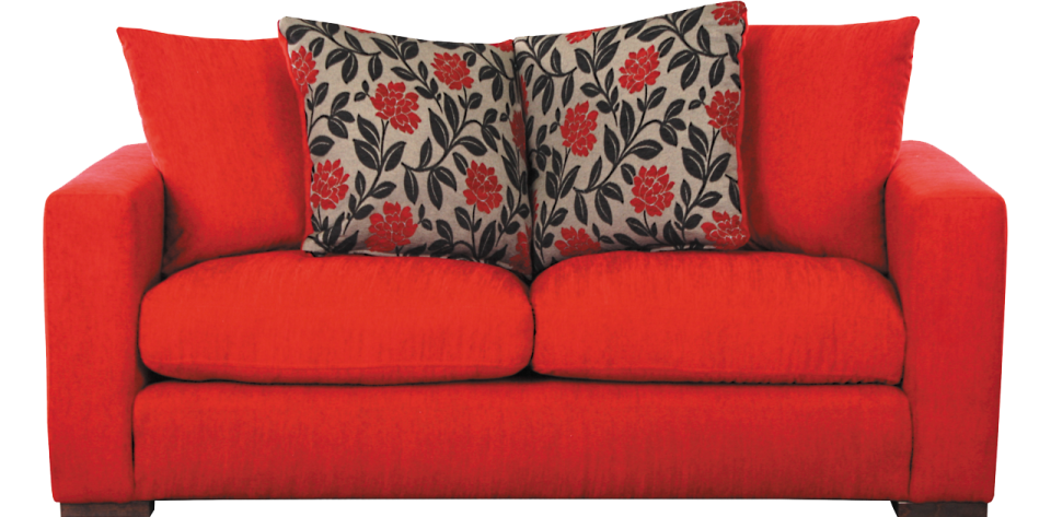a red couch with two pillows on it