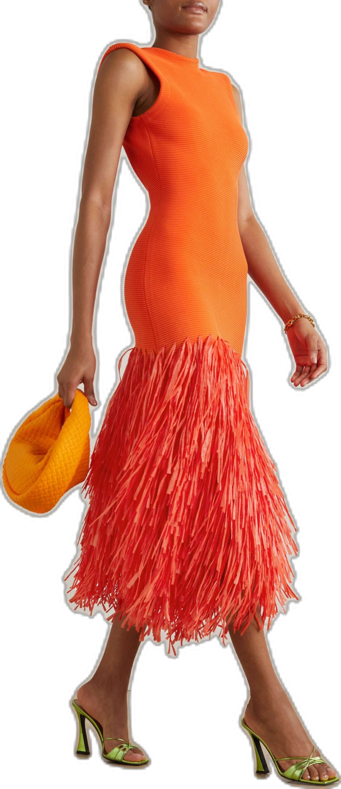 a little girl in an orange dress and yellow hat