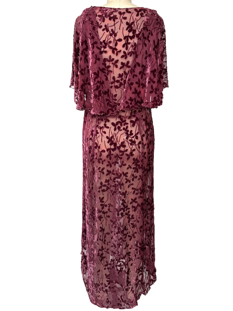 a purple dress with a floral pattern on it