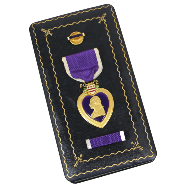 a purple and gold medal on a black case